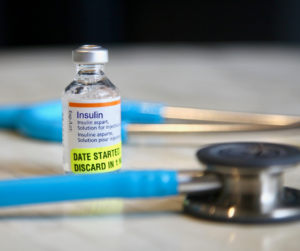 an insulin vial rests on a counter