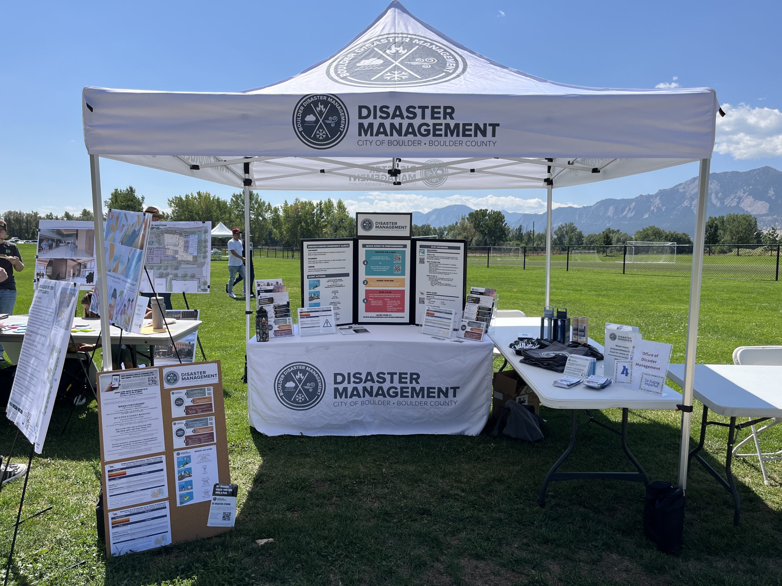 Boulder Office of Disaster Management booth set up with educational information and disaster preparedness supply giveaways.